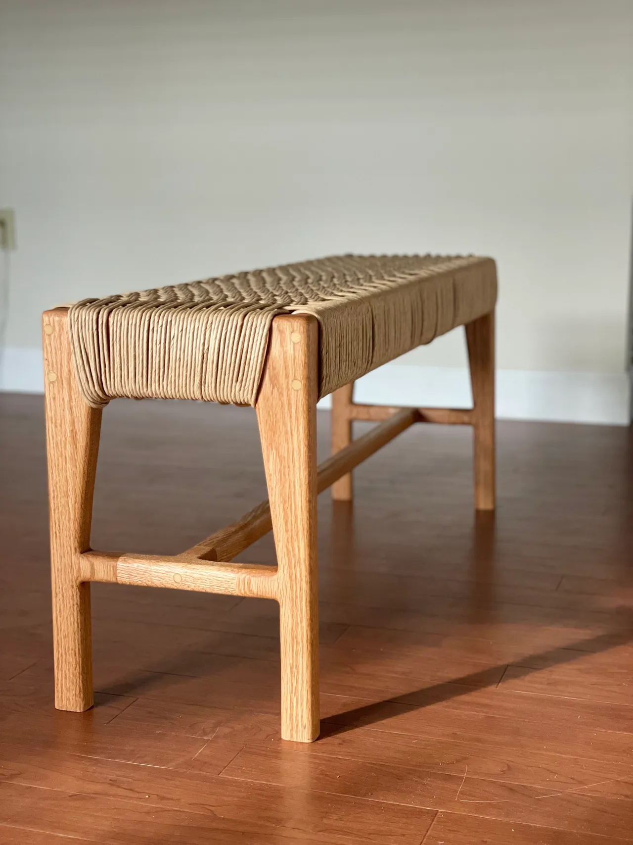 End view of the light hardwood cord bench
