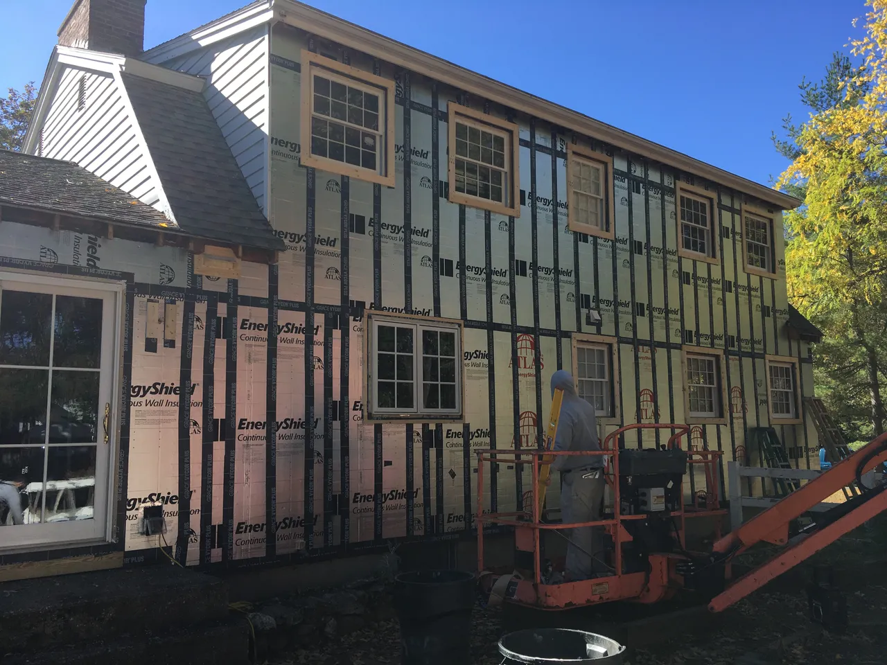 House wall with furring strips over foam insulation