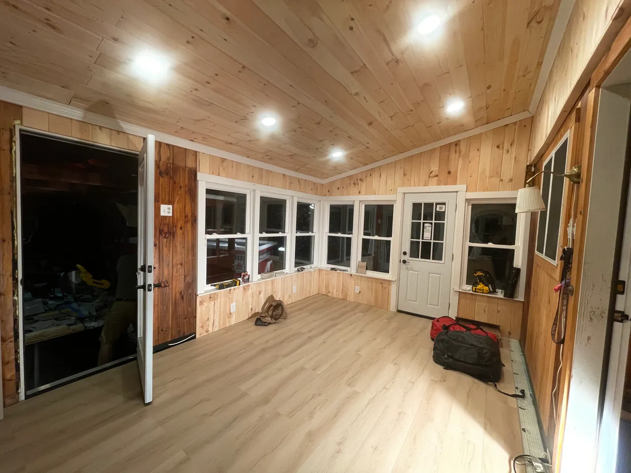 Renovated porch looking toward new windows and door