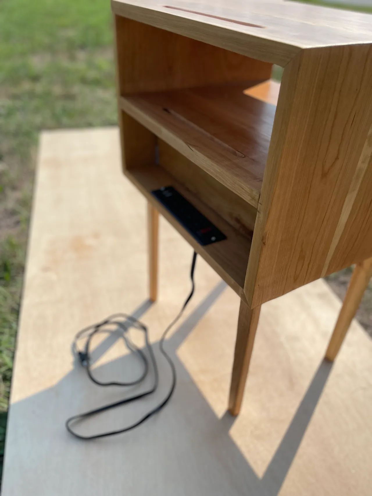 Close-up of the nightstand's cable pass-through