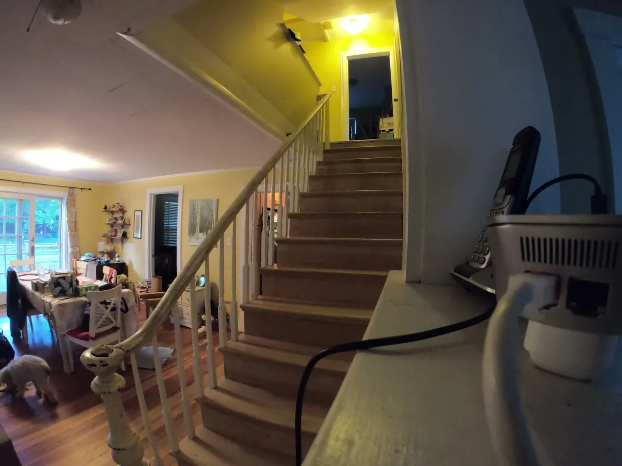 Rebuilt staircase with new hardwood treads and white railing