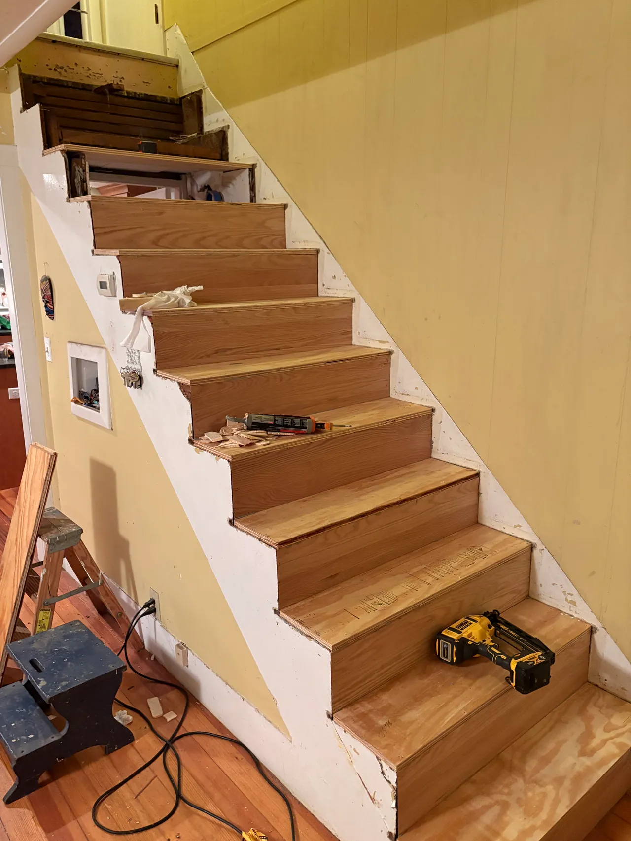 New treads and risers being installed on the staircase
