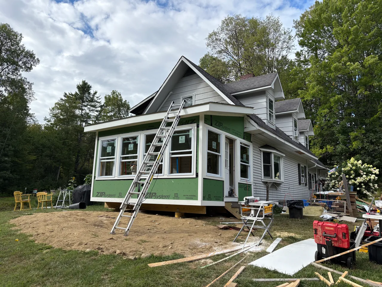 Sunroom closed in with green ZIP sheathing and new windows