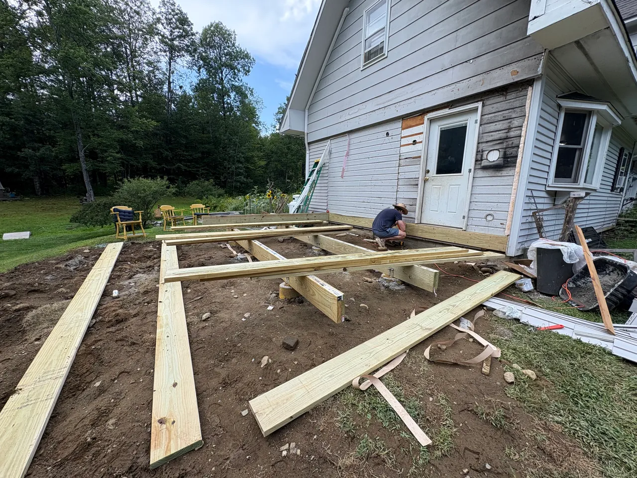 Footing layout and floor framing started beside the house