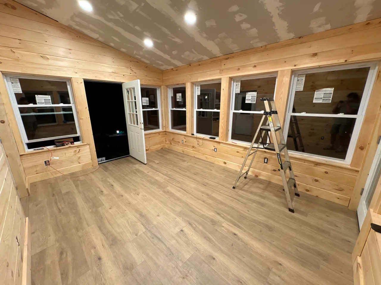 Sunroom interior looking toward the windows and doorway